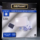 New Defiant 180-DEGREE Dusk To Dawn Motion Security Light Solar Powered 1000 Lum. Price: $19.00.
