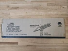 Off Grid Floodlight (solar), 4000K, 150W Hid Comp, 2K Lumens, New In Box (blk). Price: $600.00.