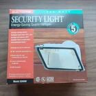 One White Electripak Security Light Compact Quartz Halogen Model Q300W. Price: $19.99.
