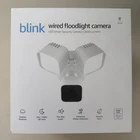 Nib Blink Wired Floodlight Camera 2600 Lumen Led, Two Way Audio, Security Siren New. Price: $35.99.