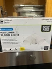 Commercial Electric Dusk Dawn White Outdoor Twin Head Led Flood Light Open. Price: $26.99.