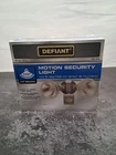 Defiant 110-DEGREE 2-LIGHT Grey Motion Activated Outdoor Flood New. Price: $24.00.