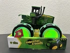 John Deere Tractor - Monster Treads Lightning Wheels Motion Activated New. Price: $20.00.