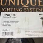 Unique Lancer 6" Path Light, 12" Riser, Weathered Brass Open. Price: $130.00.