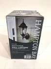 Hampton Bay 14.5 In. 1-LIGHT Oil-rubbed Bronze Outdoor Dusk-to-dawn Wall Lantern Open. Price: $39.99.