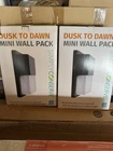 2 Pack 100-WATT Equivalent Integrated Led Black Mini Wall Light, 4000K Open. Price: $30.00.