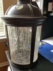 Wall Mounted Hardwired Bronze Lantern Sconce With Crackle Glass Shade Used. Price: $39.99.