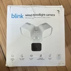 Nib Blink Wired Floodlight Camera 2600 Lumen Led, Two Way Audio, Security Siren New. Price: $40.00.