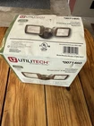 Utilitech 150W Halogen Floodlight #0071460 Model TMQ150UT Open. Price: $20.00.